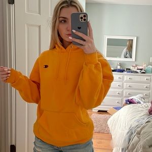 Yellow/Orange champion sweatshirt.